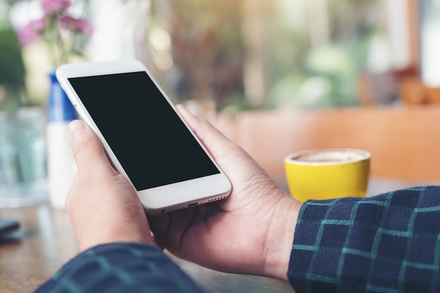 People hand using mockup smart phone