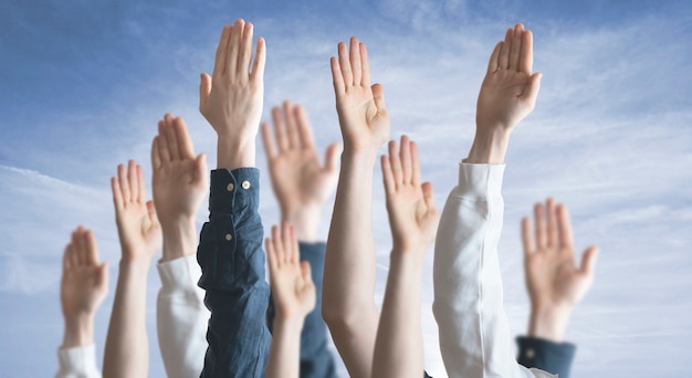 Photo the people hands raised in the air, vote, election, democracy