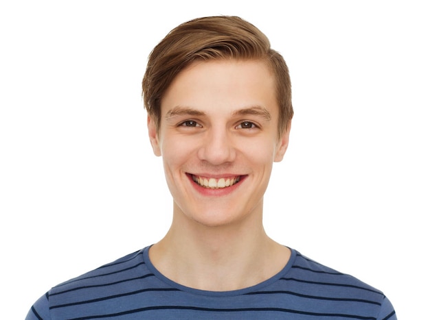 people and happiness concept - smiling teenage boy over white background