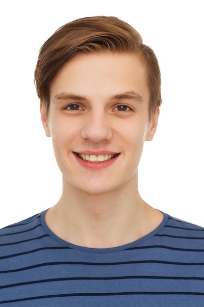 people and happiness concept - smiling teenage boy over white background