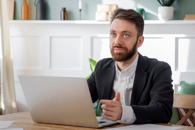 People having a debate while looking over computer