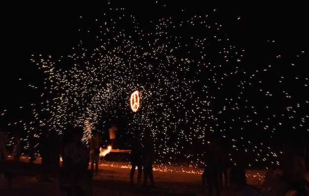 People having fun on fire party at Phi Phi Island