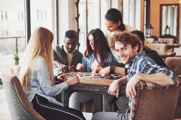 People having fun while playing board game