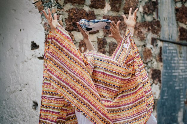 Photo people hiding under blanket during traditional festival