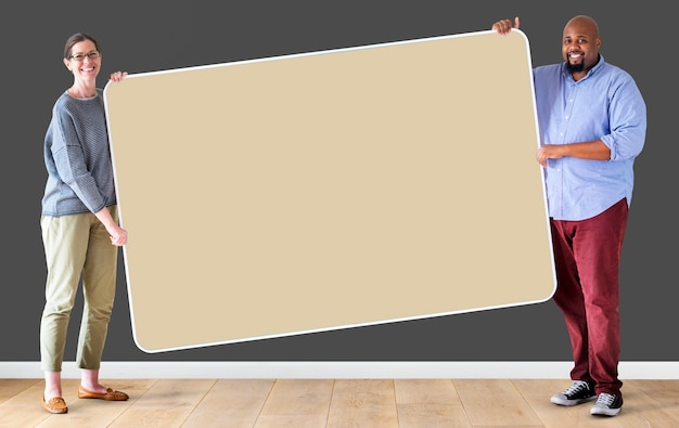 People holding a blank board