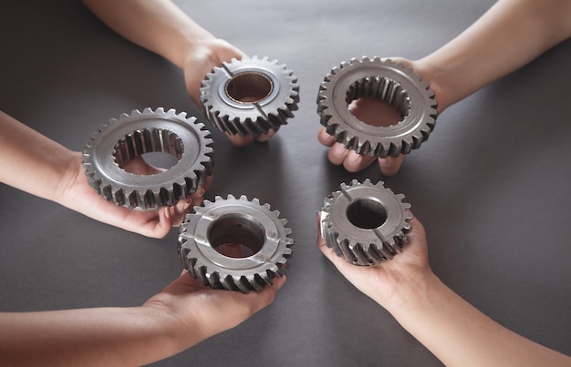 People holding gears