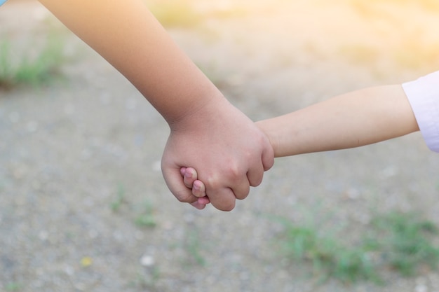 People holding hands, family concept.