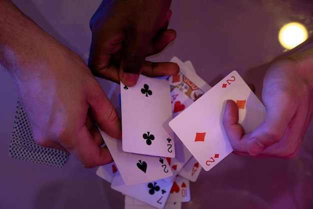 People Holding a Playing Cards Stock Photo