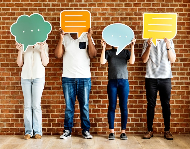 People holding speech bubble icons