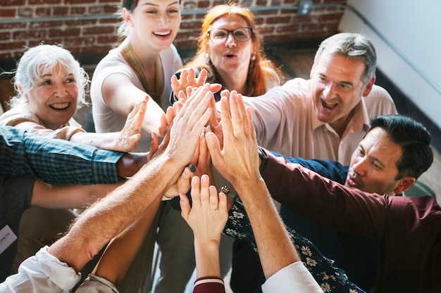 People joining hands in the air