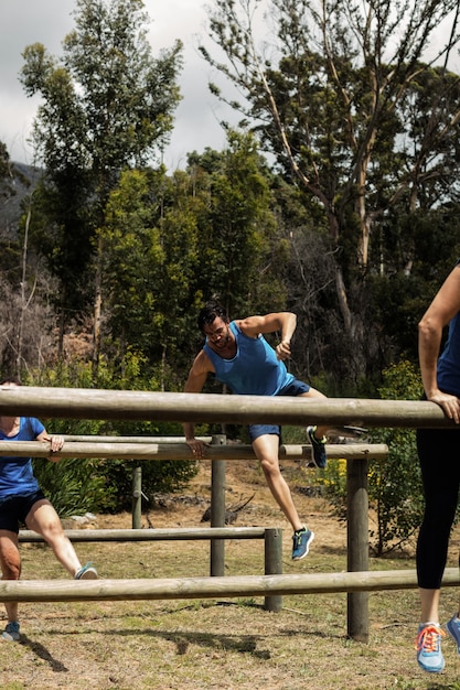 People jumping over the hurdles during obstacle course