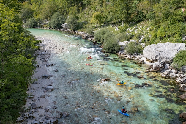 People kayaking on the river isonzo srpenica