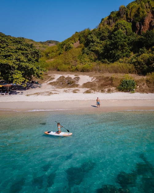 People kayaking in sea