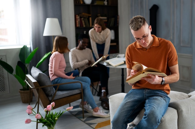 people at the library or reading club learning from books