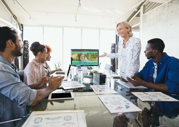 People looking at a computer with e-learning information in the screen