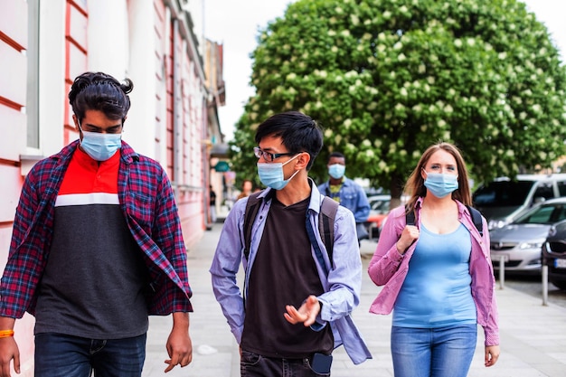 People in medical masks walking on street