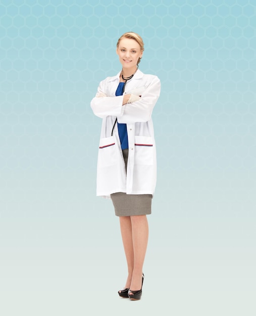 people, medicine and profession concept - smiling young female doctor over blue background