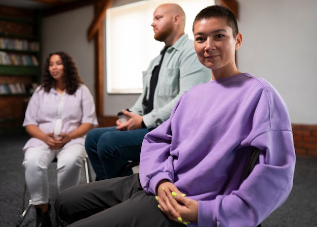 people meeting in support group