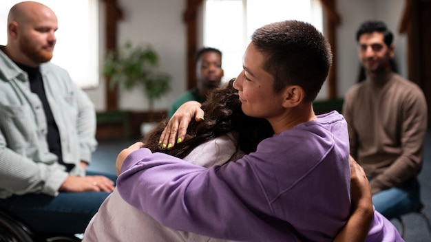 people meeting in support group