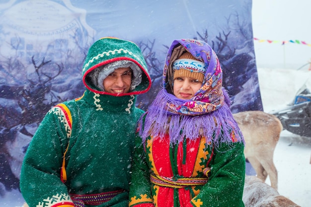 people in national costumes at a traditional reindeer herders festival