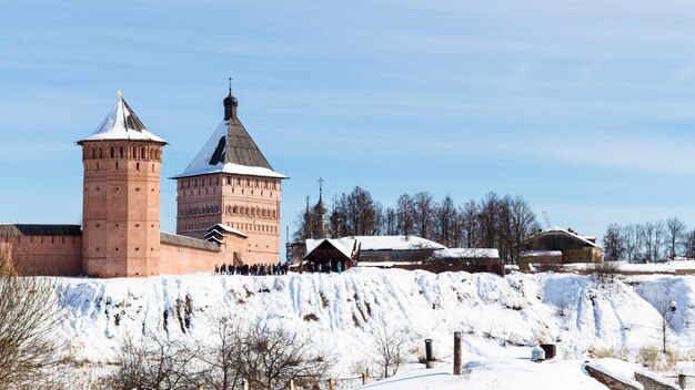 People near Passage Tower of Monastery in Suzdal