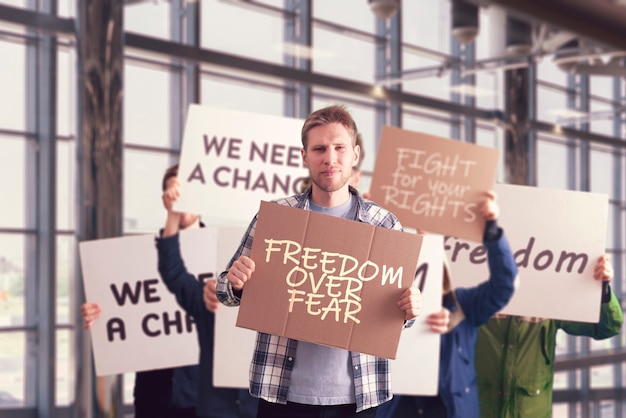 The people outside in the streets with banners on the protest march, politics event