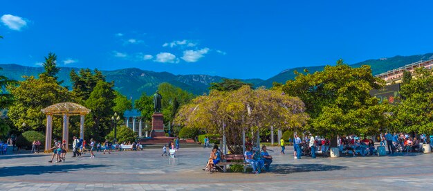 People in park against blue sky