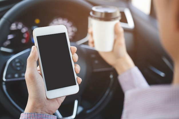 People person drinking paper cup coffee of hot holding hand in a car in the morning not sleepy be energetic while driving.