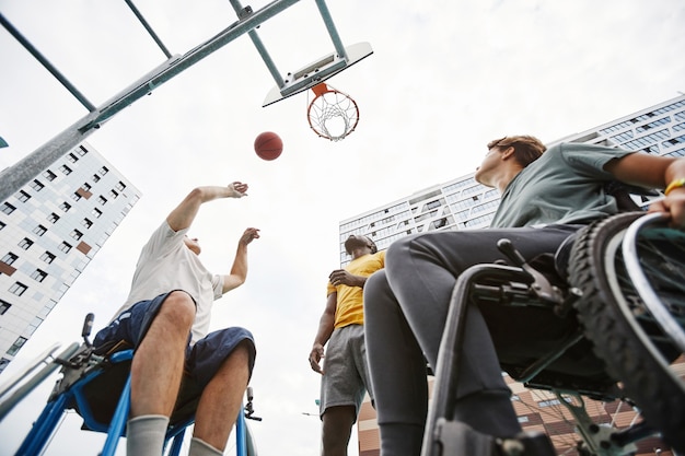 People playing basketball outdoors