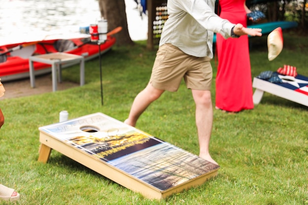 Photo people playing cornhole a popular american sport representing camaraderie outdoor leisure compet