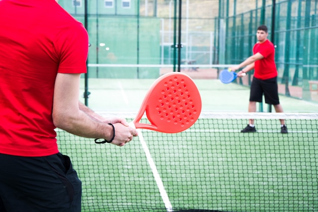 Photo people playing padel tennis, also known as paddle tennis