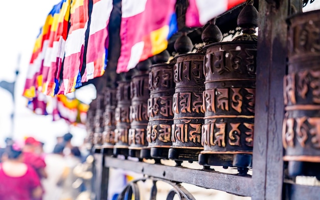 people playing prayer wheel infrom of temple, at Kathmandu, Nepal.