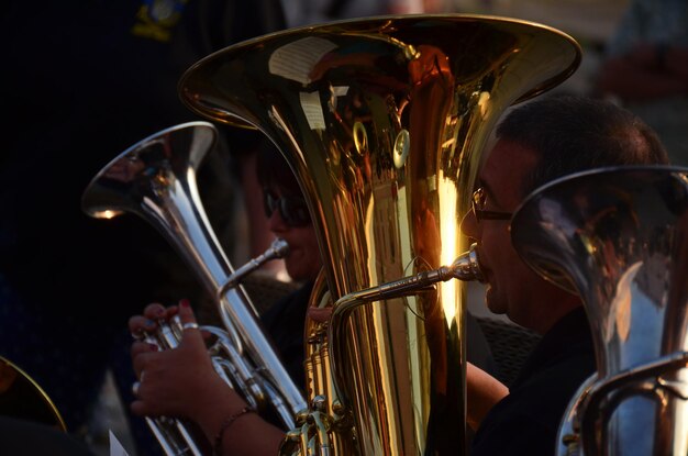 Photo people playing tuba at music festival