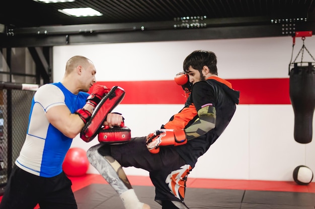 people practicing boxing in ring