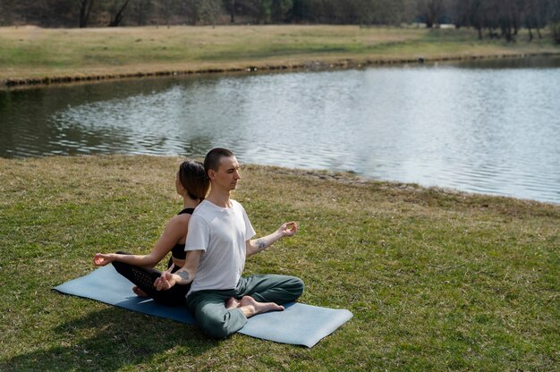 People practicing yoga outside