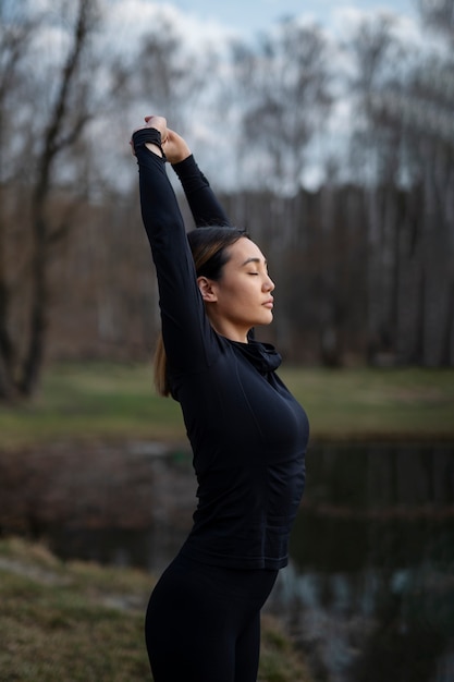 People practicing yoga outside