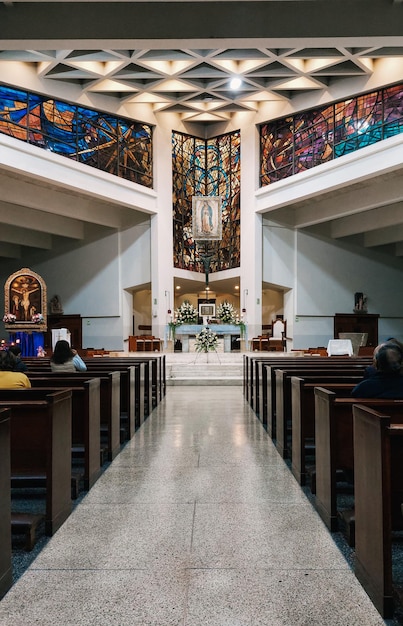 People praying inside Virgen de Guadalupe church in Lima Peru