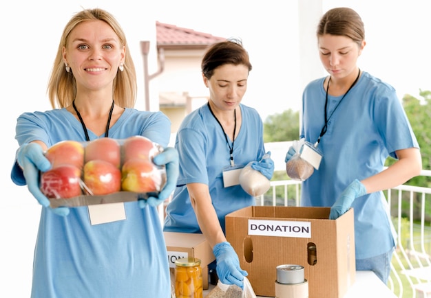 People preparing boxes to donate for food day