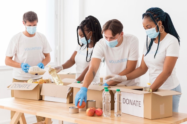 People preparing donations packages