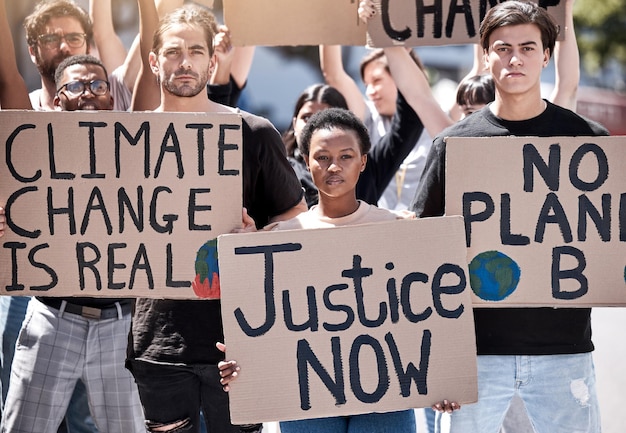 people protest and justice for planet in portrait outdoor demonstration and rally for action in society fight saving earth and community for voice climate change board and international problem