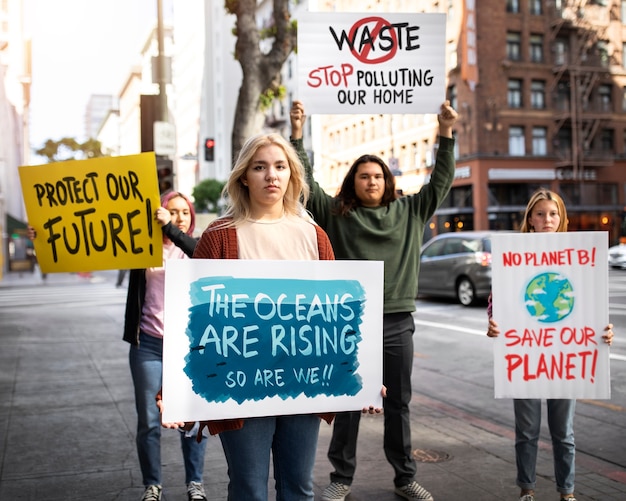 people protesting with placard in the city for world environment day