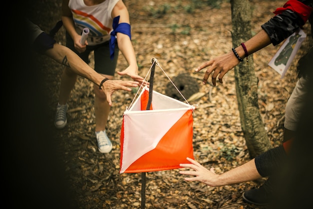 People racing to an orienteering check point