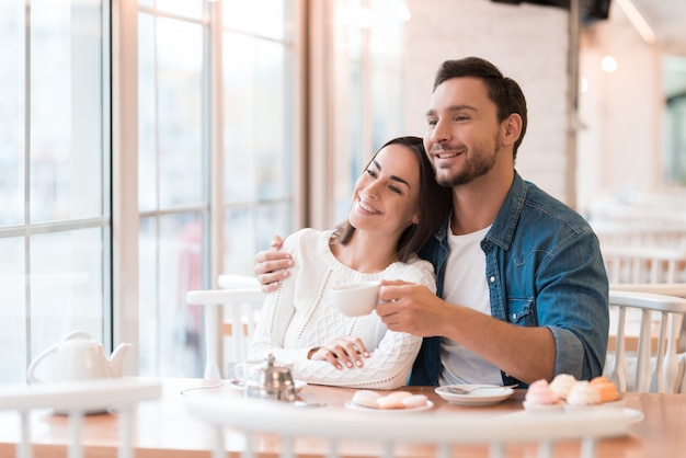 People Recall Sweet Memories Happy Couple in Cafe.