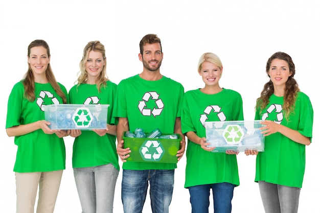 People in recycling symbol tshirts carrying boxes