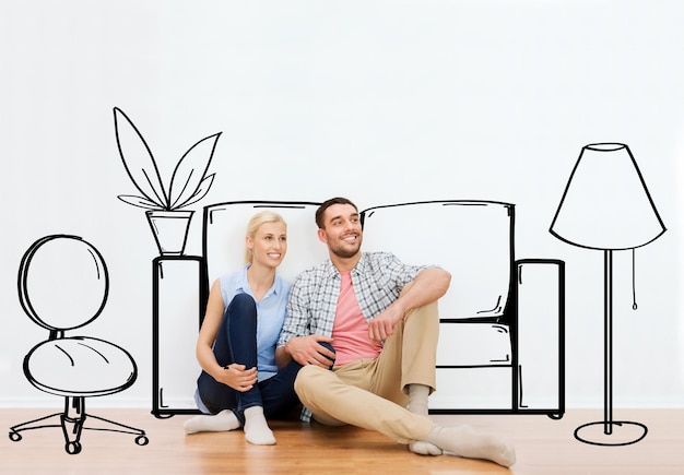 people, repair, moving in, interior and real estate concept - happy couple of man and woman sitting on floor at new home over furniture cartoon or sketch background