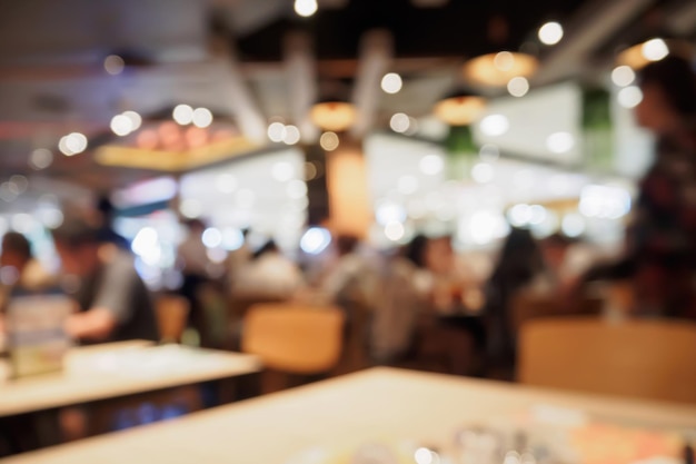 People in restaurant cafe interior with bokeh light blurred customer abstract background