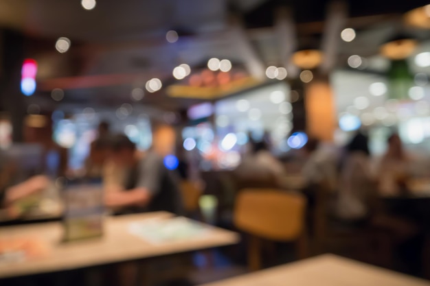 People in restaurant interior with bokeh light blurred customer abstract business background