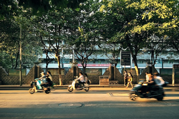 People riding motorcycle on road