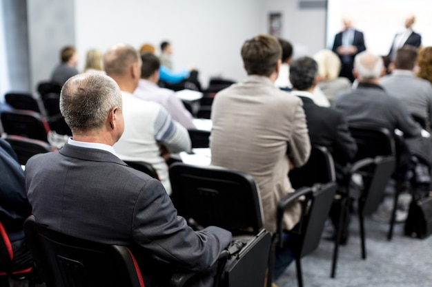 People in a Room for a Seminar , Meeting , Conference