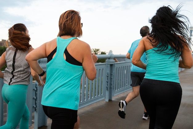 People running outdoors medium shot